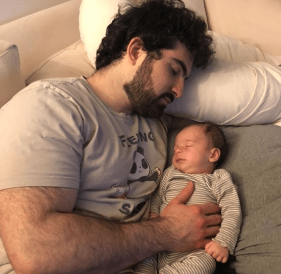 Jeremy Cher sleeps with his first child (picture: Instagram).